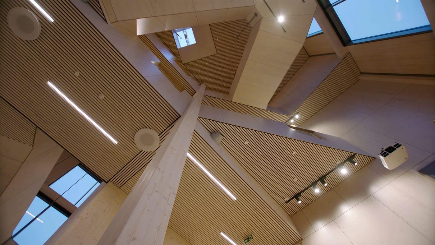The timber-ceilinged interior of Gruben primary school, with rooflights